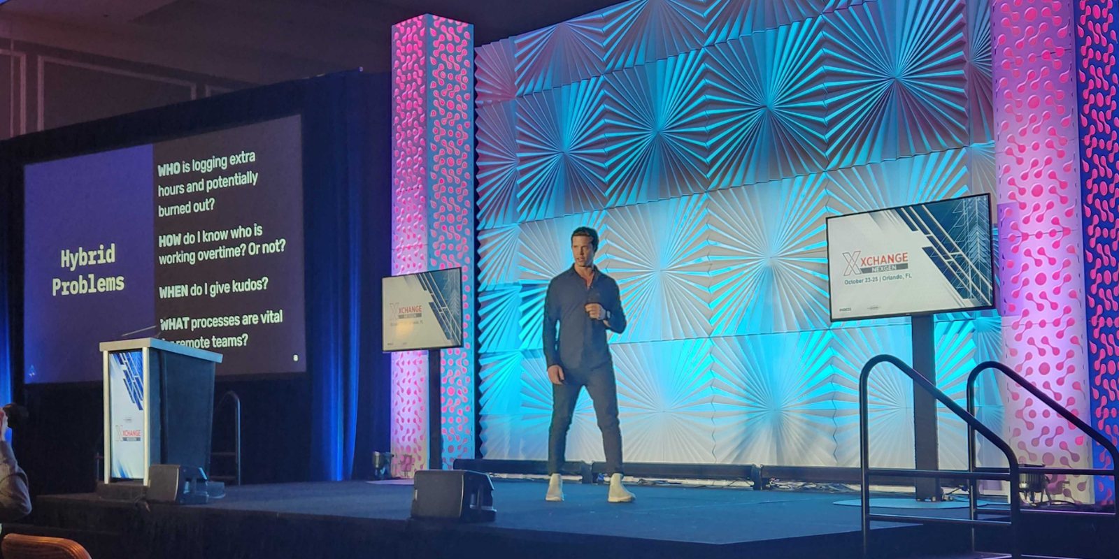 Chris Keith speaking on stage at a channel event